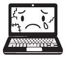 A laptop with a broken screen and a sad face on it.