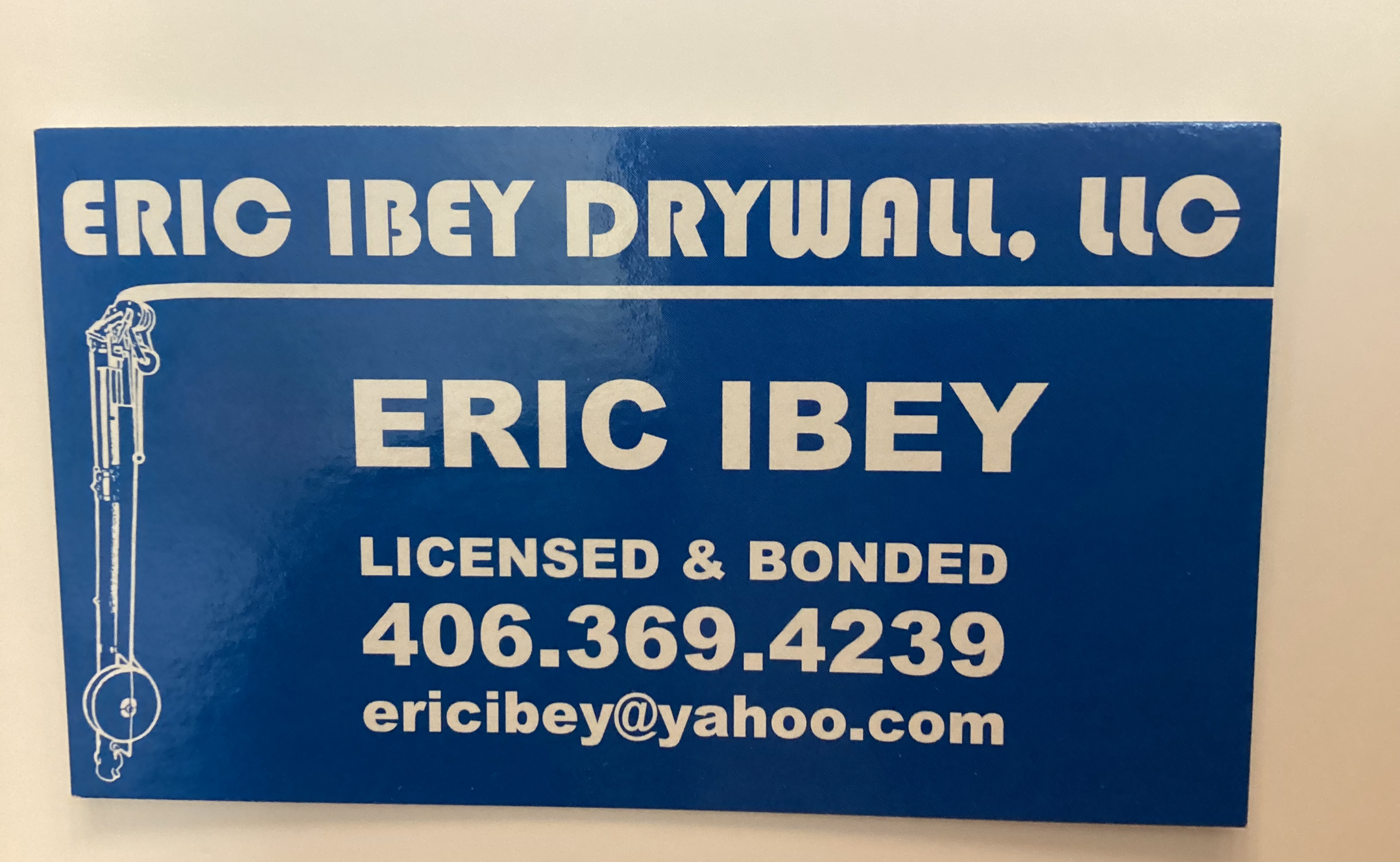 a blue sign for eric ibey drywall llc